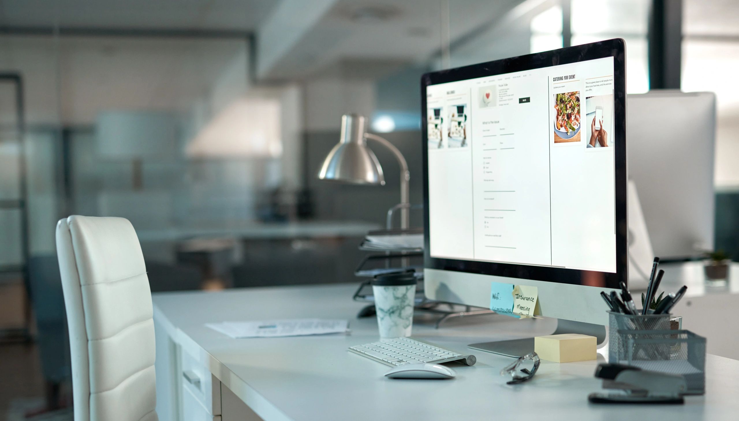 Modern office desk with computer symbolizing digital publishing and editorial review