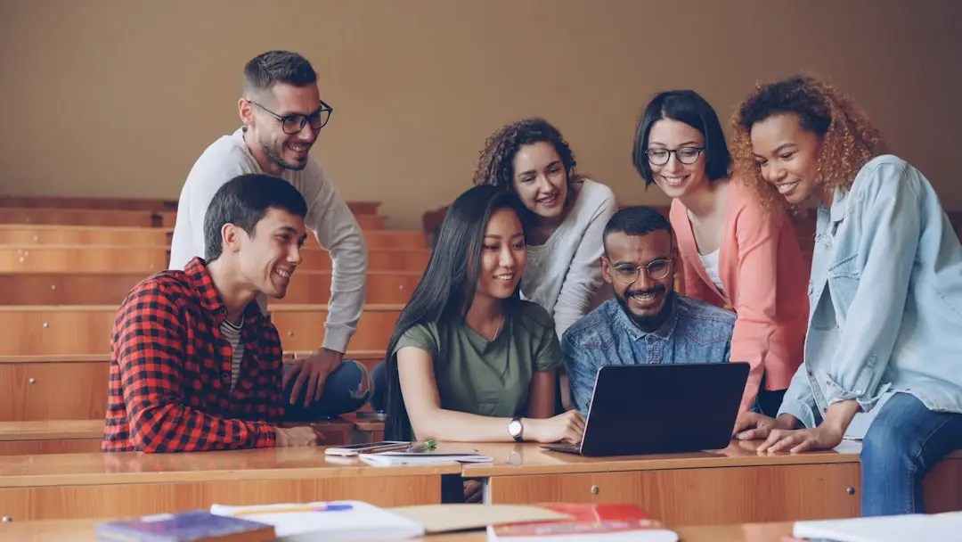 College students using a laptop representing Google Gemini free student offer in India 2026