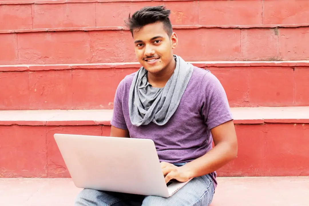 Young Indian job seeker using a laptop for India Post GDS Recruitment 2026 application